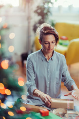 Woman wrapping Christmas presents