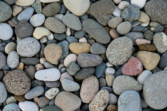 Round pebbles sea texture background