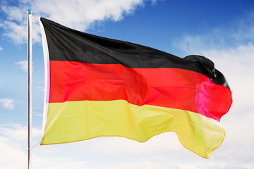 Germany flag waving under blue sky