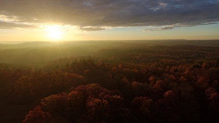 sunset over a colorful fall landscape