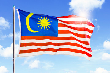 Malaysia flag waving with sunlight background