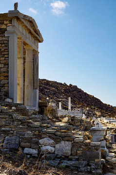 Archeologic ancient and historic and temple ruins with columns and walls on museum island Delos excavation site in Greece in the Aegean Sea with Apollon Sanctuary