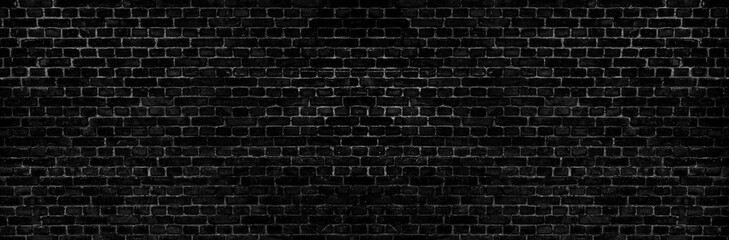 Abstract image of Rustic black grunge brick wall texture background for interior decoration.