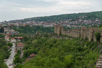 Fototapeta na wymiar Gate tower and ruins of Tsarevets fortress with a view of the old town of Veliko Tarnovo in the background, Bulgaria