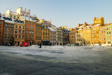 Houses in old town market square, Warsaw, Poland. Winter time with snow