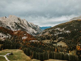 Fototapeta na wymiar Alpine autumn mountain scenery with colorful trees