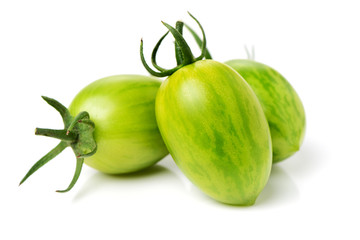 Green tomatoes on white background