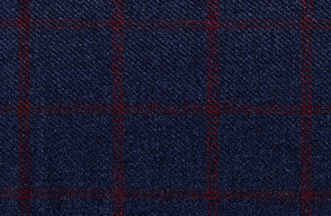 Dark blue woolen fabric. Classic red check. Geometric patterns in fabrics. Wool. Traditional Scottish Glen plaid. High resolution