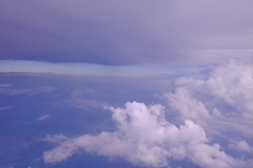 Naklejka na ściany i meble Blue sky white fluffy clouds,a view from a plane windoow