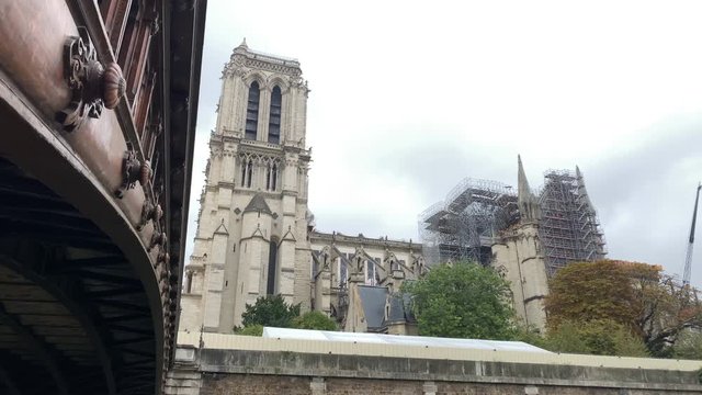 the burnt-down Notre-Dame cathedral in the rain