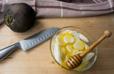 Black radish, cut into pieces with a knife, in honey