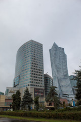 Cityscape with skyscrapers in the center of Warsaw near the railway station on a cloudy autumn day.