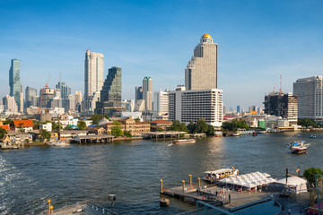 Fototapeta na wymiar Bangkok skyline and business skyscrapers at Chaopraya river