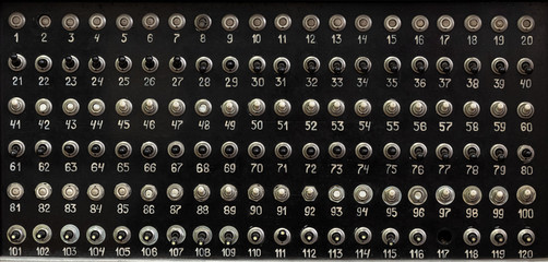 Retro control panel with many switches background.