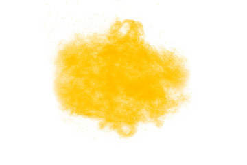 Yellow  powder explosion cloud on black background. Freeze motion of color dust  particles...
