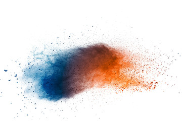 Abstract multi color powder explosion on white background.  Freeze motion of  dust  particles splashing.