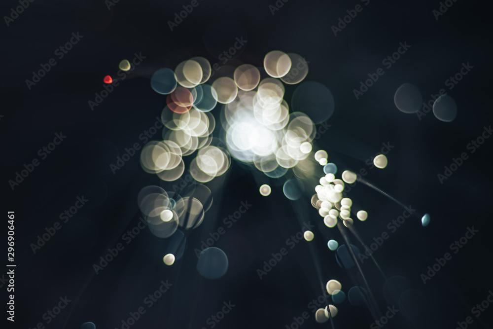 Aufkleber beautiful abstract fiber optical network cable on a multi colored glow background.