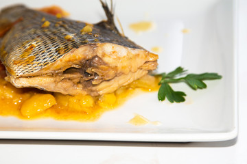 stewed fish dish with potatoes and peppers