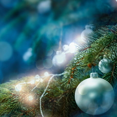 Christmas decorations in bright blue red and white shiny colors with Christmas lights with blurred background.