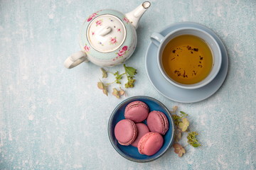 pink macaroons with teapot and Cup