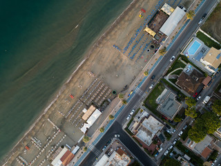 Top view of a beach relaxation area with beach umbrellas. Terracina, Latin Province, Lazio, Italy