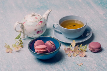 pink macaroons with teapot and Cup