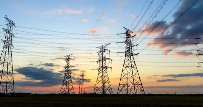 Time Lapse of Electric High Voltage Pylon.Silhouette of Electricity Power Lines.Tower and High Voltage Power Line at sunset.