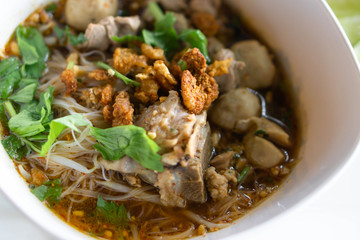 Rice noodle soup with Cooked Liver in  bowl on table, selective focus