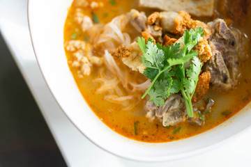 Rice noodle soup with Cooked Liver in  bowl on table, selective focus