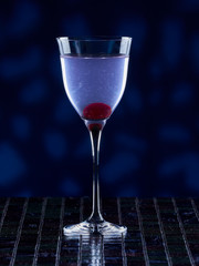 Aviation cocktail on blue background