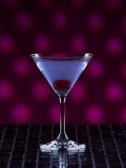 Aviation cocktail on pink dotted background