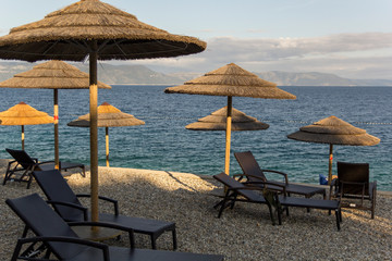 Modern deck chair on a sandy beach