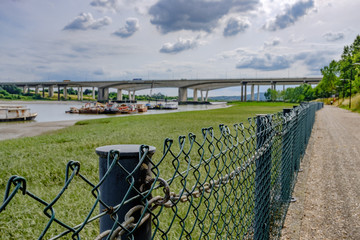 Close-up view of the wire fencing seen adjacent to a footpath which spans a Kent river. The...