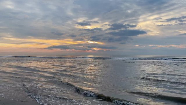 Sunset on the beach in Zandvoort. It is a popular beach destination located near to Amsterdam, with clean sandy beaches, popular beach bars and family activities.