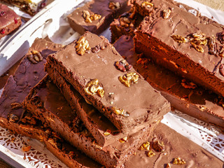 Delicious home baked brown chocolate bars with walnut seeds close up shot at the local fair.