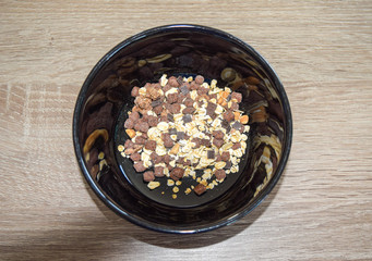 oatmeal in a bowl with chocolate on a table