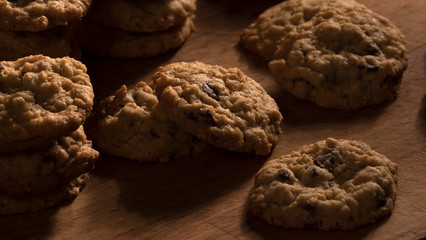 Oatmeal chocolate chip cookies on a wooden cutting board
