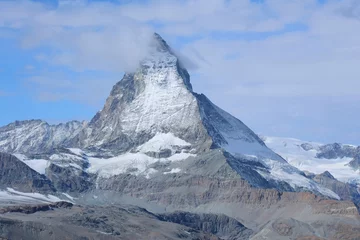 Foto op Canvas The Matterhorn is the Mountain of Mountains. Shaped like a jagged tooth, it straddles the main watershed and border between Switzerland and Italy. © Cristina D'Annunzio