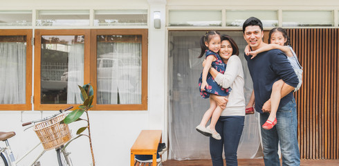 Portrait Asian family front of house, happy family home concept