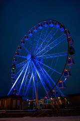 Photo of ferris wheel against background of night sky