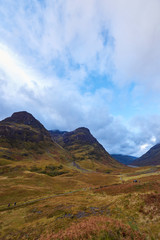 Looking down Glencoe to the West, with walkers on the West Highland way making their way along the Footpath on a wet Octobers day.