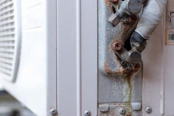 The air conditioner has leaks  of refrigerant and water
