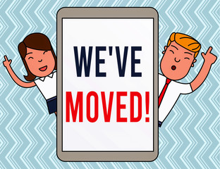 Writing note showing We Ve Moved. Business concept for To go from one residence or location to another Relocate Male and Female Index Fingers Up Touch Screen Tablet Smartphone Device