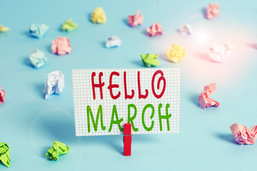 Conceptual hand writing showing Hello March. Concept meaning musical composition usually in duple or quadruple with beat Colored clothespin rectangle shaped paper blue background