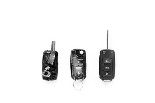 Broken or damaged remote key fob of any vehicle car service center. Flat lay isolated on white background.- Image