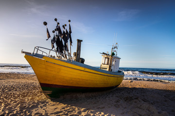 Naklejka na ściany i meble fishing ships on the beach in Rewal, Polish Baltic coast