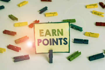 Conceptual hand writing showing Earn Points. Concept meaning getting praise or approval for something you have done Colored clothespin papers empty reminder white floor office