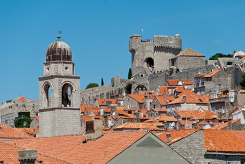 Fototapeta premium Croatia: Walls and roofs of Dubrovnik with sight on Minceta Tower and Dubrovniks Clock tower