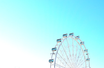 ferris wheel against the sky on a summer day