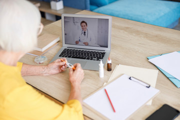 Adult woman is having online doctor consultation